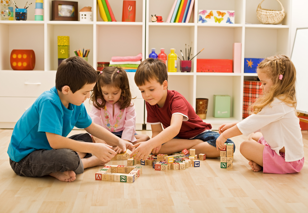 Children,Playing,With,Blocks,On,The,Floor,-,Focus,On