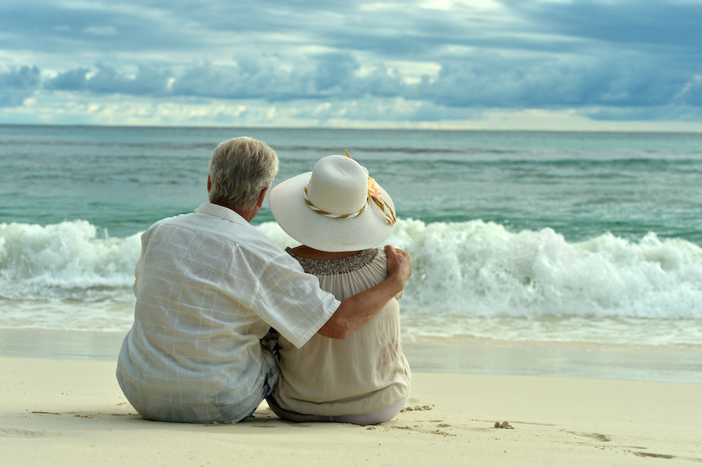 Elderly couple rest at tropical resort