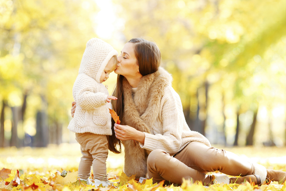 Mother and daughter in autumn park