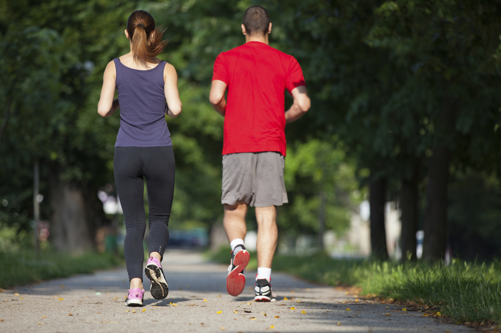 Young running couple jogging