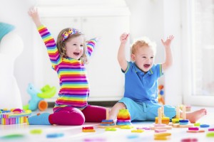 Cjildren playing with wooden toys