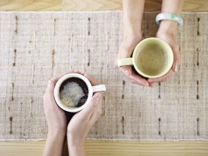 hands holding coffee