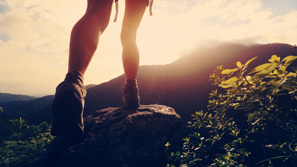 Young,Hiker,Legs,Hiking,On,Mountain,Peak