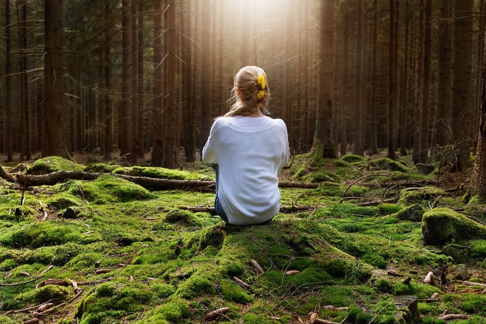 Younf,Female,Sitting,Alone,In,Green,Forest,Enjoys,The,Silence