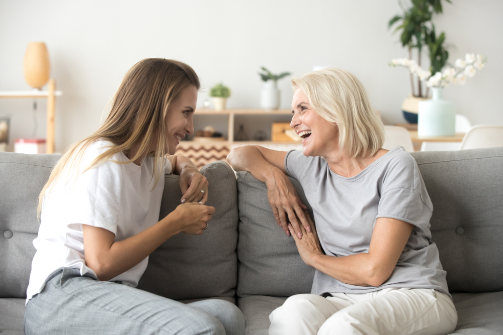 Cheerful,Old,Mother,And,Young,Adult,Woman,Talking,Laughing,Together,