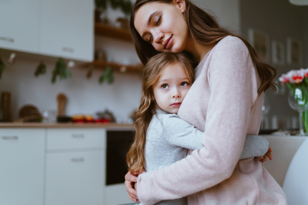 Mom,Gently,Hugged,Her,Daughter,,The,Girl,Snuggles,Up,To