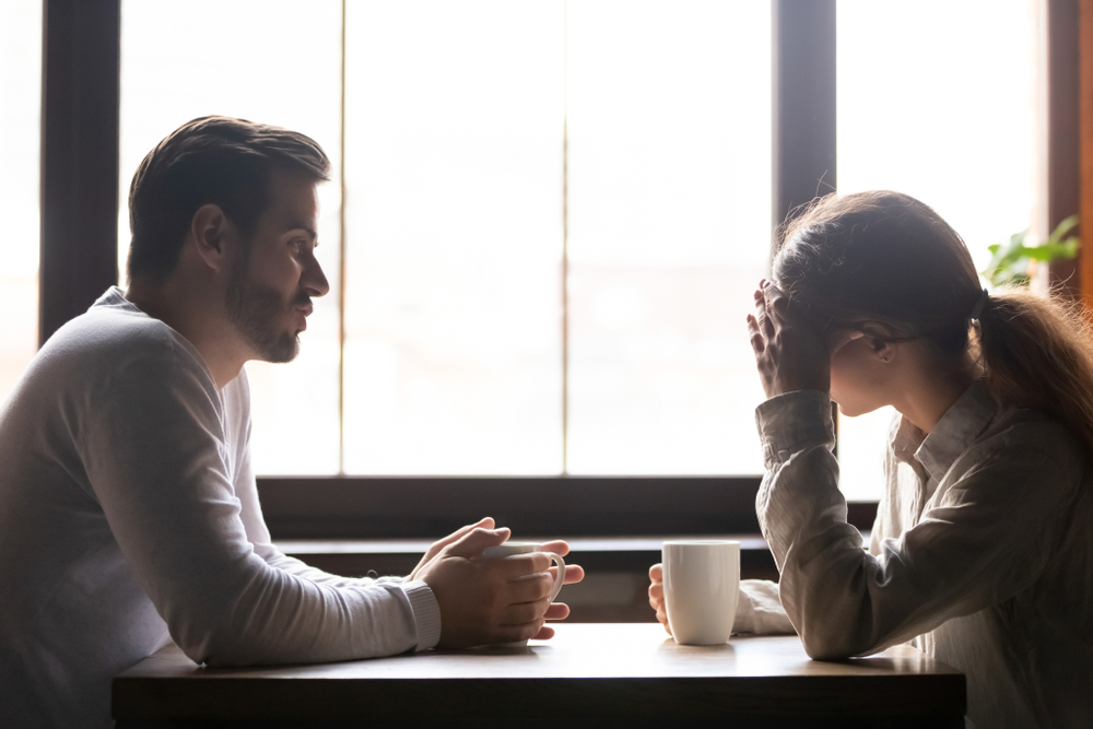 Upset,Woman,And,Man,Talking,In,Cafe,About,Problem,In